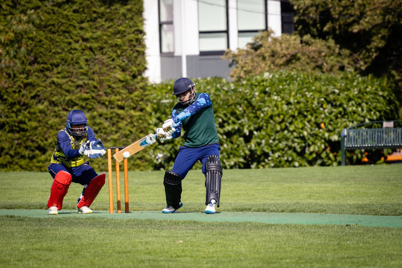 A thrilling moment captured during a cricket game with the batter and wicket-keeper in action.